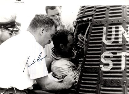 Mercury era photo of astronaut being removed from MA-9 spacecraft. Cooper AUTO