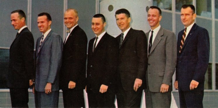 3x6 card with Original 7 Mercury astronauts in business attire